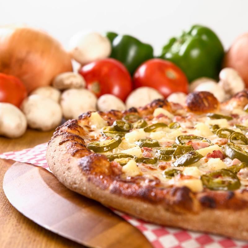 Pizza with pineapple and jalapenos from Pizza iQ